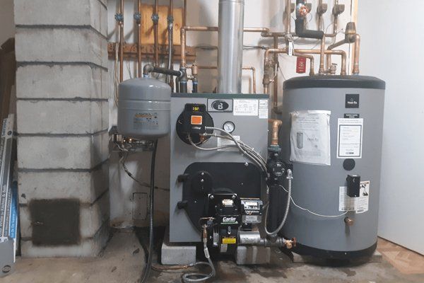 A modern high-efficiency Buderus boiler and Heat-Flo water heater installed by Gottier